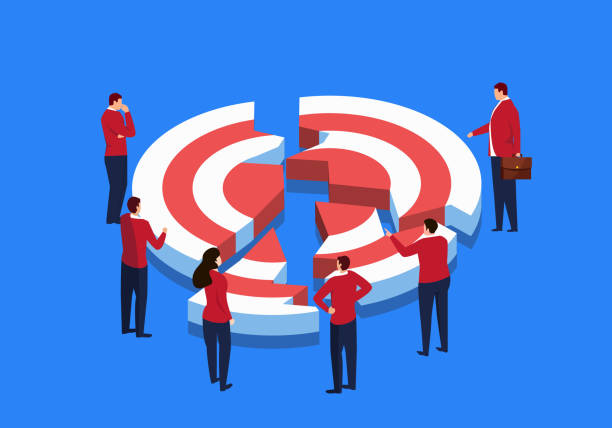 a group of businessmen around a broken target