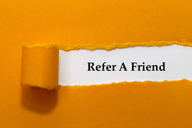 Refer A Friend Written Under Orange Torn Paper