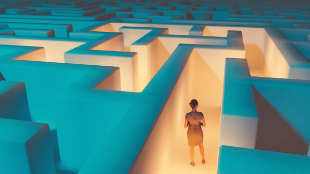 Woman stands in the middle of dark maze. Lights guide the way for her. Concept of standing in front of a challenge and finding the right solution to move on.