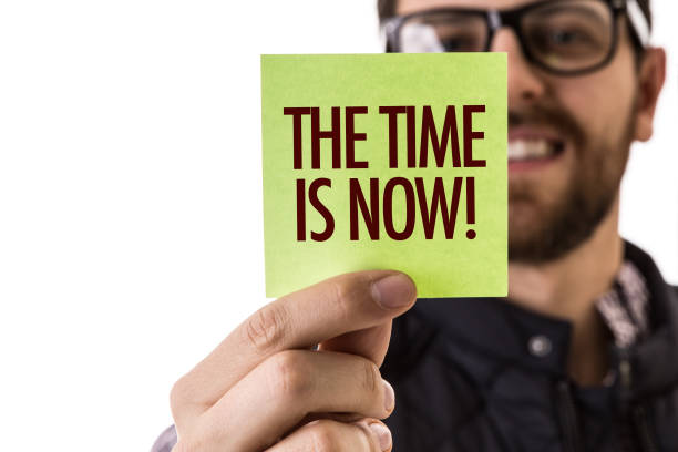 The Time is Now sign