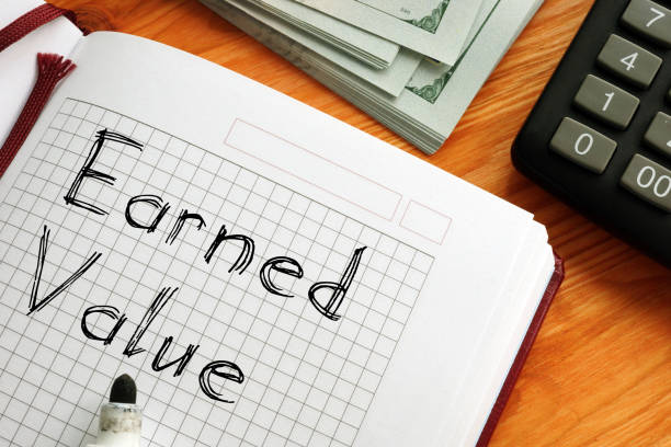 Earned Value is shown on a business photo using the text